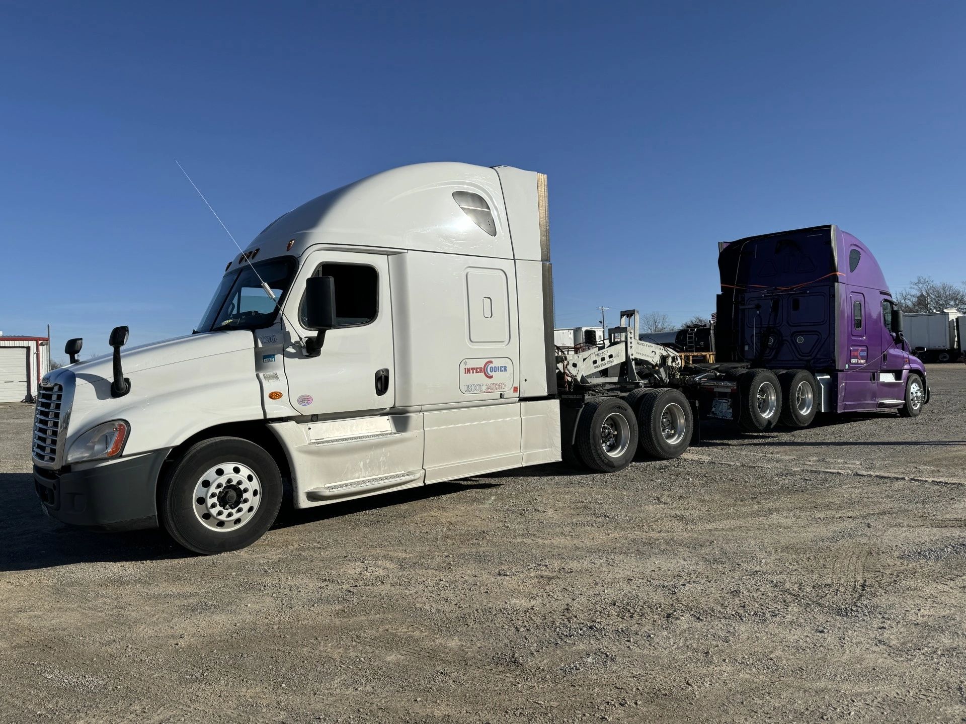 Semi-trucks parked in commercial lot