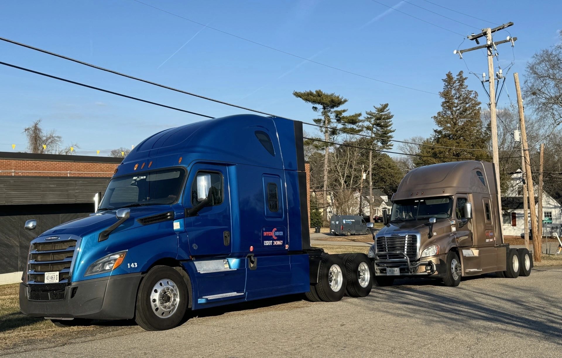 Two semi-trucks parked side by side